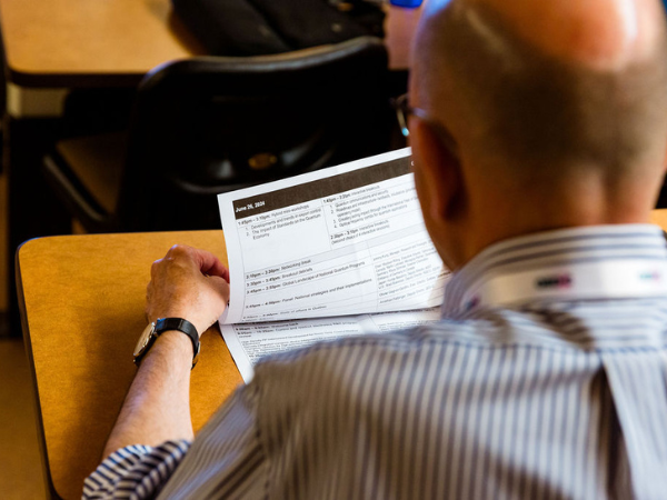 Man flipping pages of a report